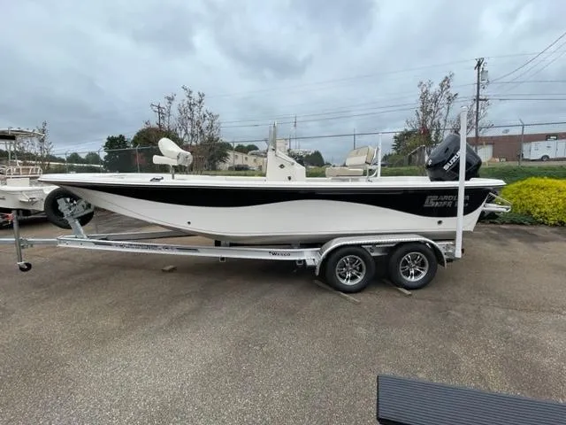 Slide: The Image of 2024 Carolina Skiff 21LS boat on trailer, parked outdoors. - 3