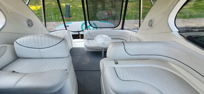 Slide: The Image of Interior of 2006 Maxum 3100 SE boat with white leather seating and table. - 5
