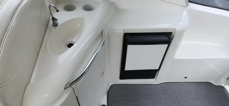 Slide: The Image of 2006 Maxum 3100 SE boat interior with sink and mini fridge. - 6