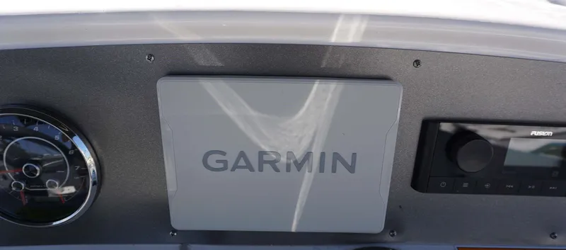 Slide: The Image of Dashboard of 2024 Hurricane 231 SS boat with Garmin and Fusion systems. - 13