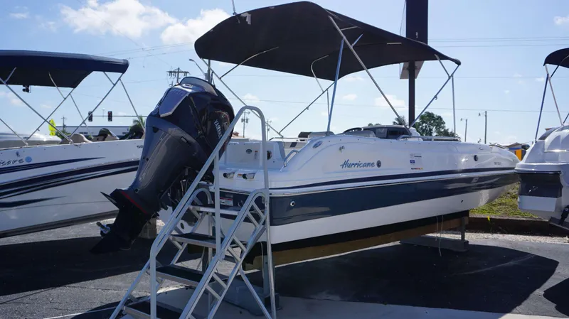 Slide: The Image of 2024 Hurricane 231 SS boat with Yamaha outboard motor on display. - 15