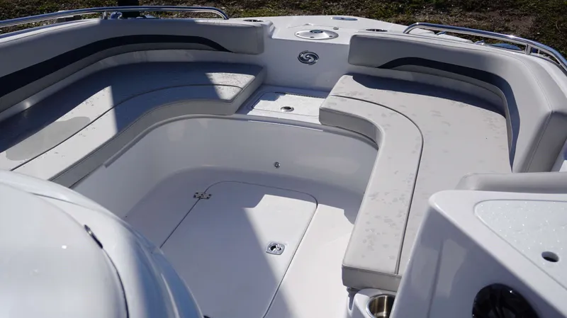 Slide: The Image of 2024 Hurricane 231 SS boat interior with spacious seating and storage compartments. - 17