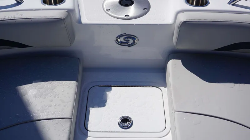 Slide: The Image of 2024 Hurricane 231 SS boat interior with wet seating and storage compartment. - 18