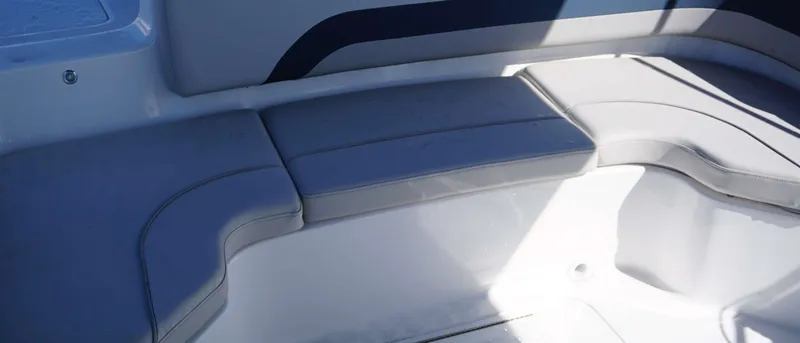 Slide: The Image of 2024 Hurricane 231 SS boat seating area with cushioned seats. - 7