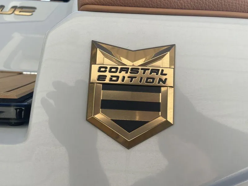 Slide: The Image of 2022 Nautique Super Air Nautique G23 Coastal Edition badge on boat exterior. - 3