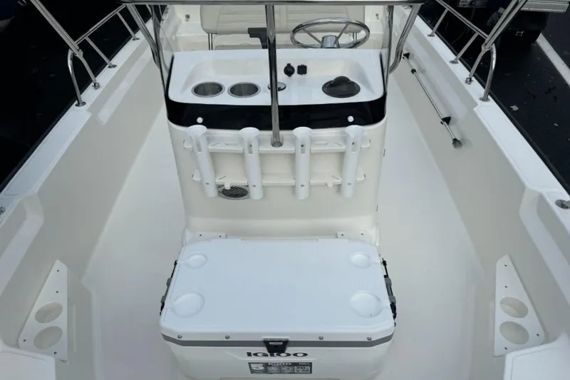 Slide: The Image of 2024 Boston Whaler 170 Montauk boat interior with console and Igloo cooler. - 12
