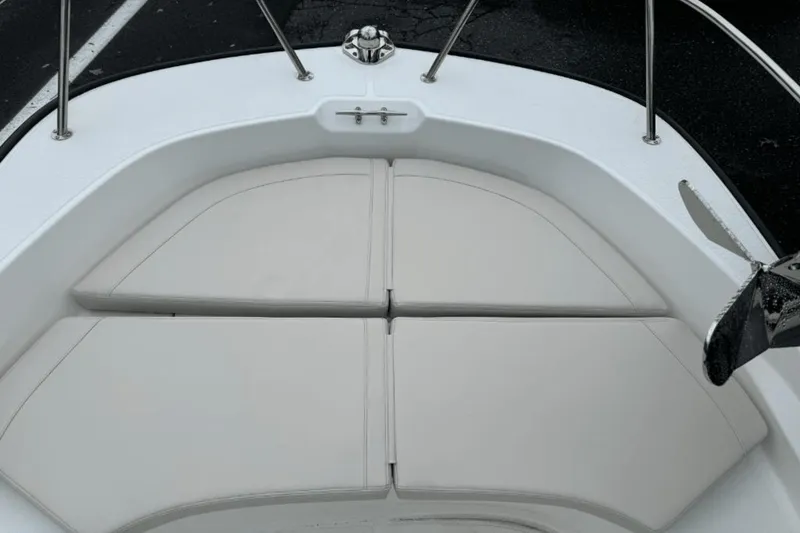 Slide: The Image of 2024 Boston Whaler 170 Montauk bow seating area with cushioned pads. - 15