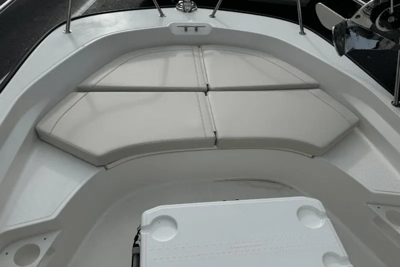 Slide: The Image of 2024 Boston Whaler 170 Montauk bow seating area with cushioned pads. - 16