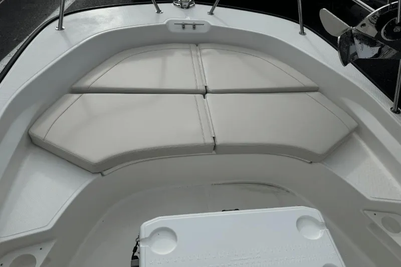 Slide: The Image of 2024 Boston Whaler 170 Montauk bow seating area with cushioned pads. - 17