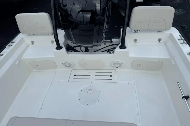 Slide: The Image of 2024 Boston Whaler 170 Montauk boat interior with seating and storage compartments. - 7
