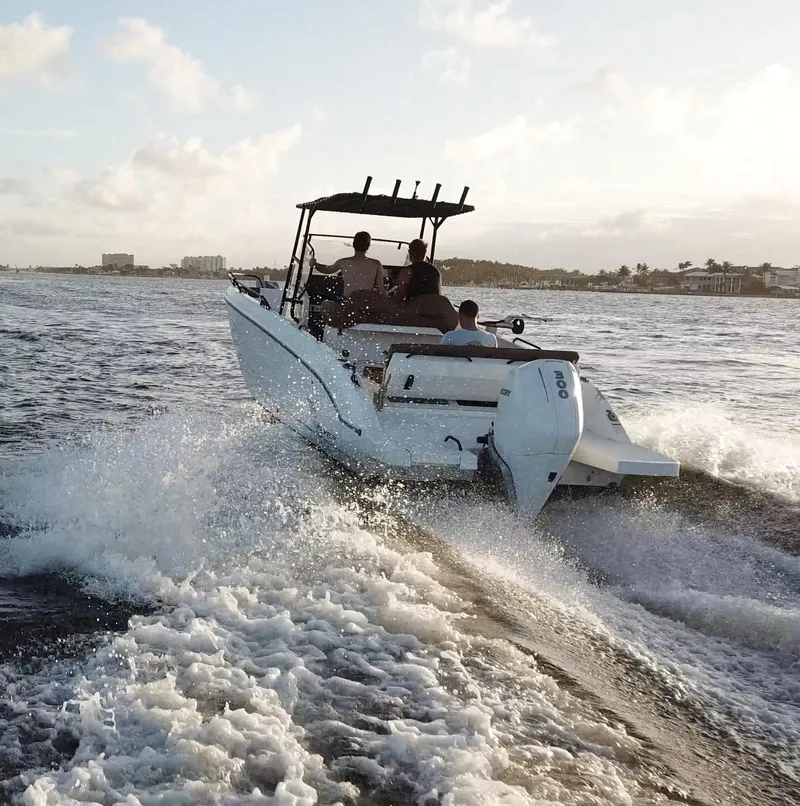 The Image of 2020 Beneteau Flyer 8 SPACEdeck cruising on open water at sunset. - 0