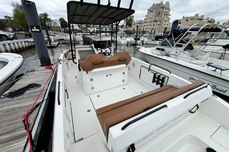 Slide: The Image of 2020 Beneteau Flyer 8 SPACEdeck docked at marina, featuring spacious deck and seating. - 10