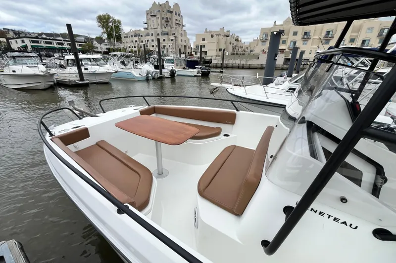 Slide: The Image of 2020 Beneteau Flyer 8 SPACEdeck boat with seating and table in a marina setting. - 11