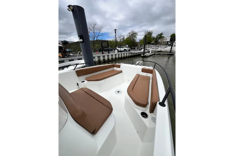 Slide: The Image of 2020 Beneteau Flyer 8 SPACEdeck boat with brown seating, docked at marina. - 15
