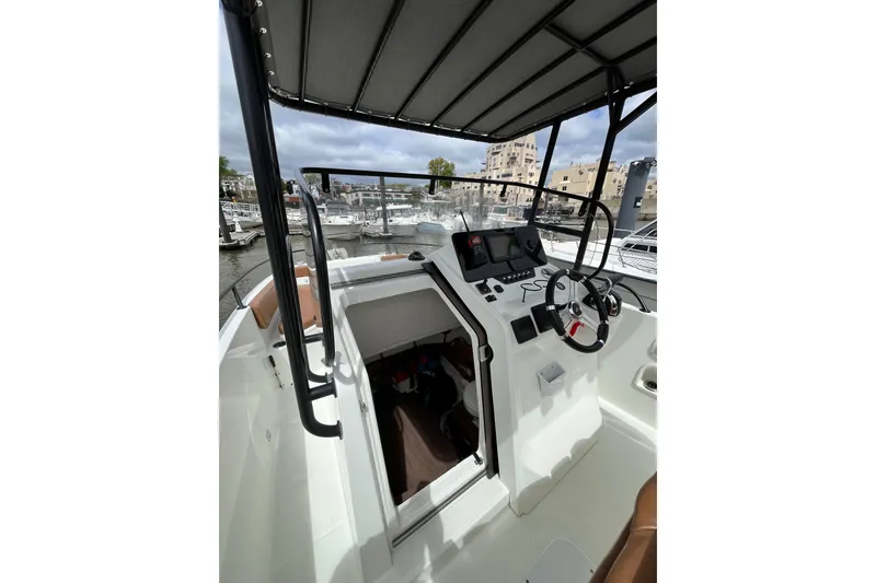 Slide: The Image of 2020 Beneteau Flyer 8 SPACEdeck boat interior with steering wheel and control panel. - 17