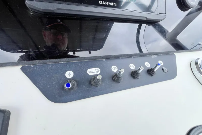 Slide: The Image of Control panel of a 2020 Beneteau Flyer 8 SPACEdeck with switches and Garmin display. - 23