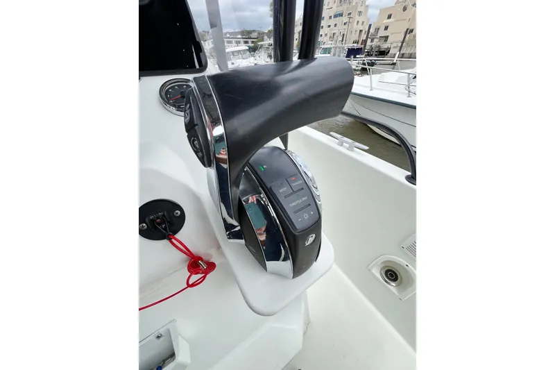 Slide: The Image of Control panel of a 2020 Beneteau Flyer 8 SPACEdeck boat, featuring modern throttle controls. - 26