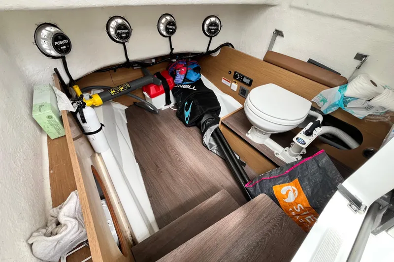 Slide: The Image of Interior of 2020 Beneteau Flyer 8 SPACEdeck with toilet, speakers, and storage items. - 29