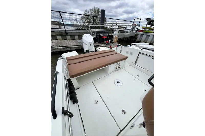 Slide: The Image of 2020 Beneteau Flyer 8 SPACEdeck boat interior with seating and Mercury engine at dock. - 36