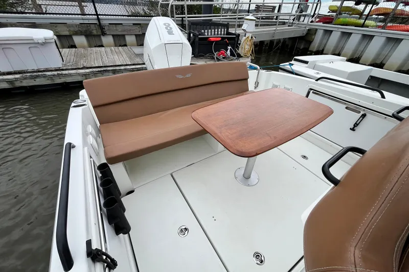 Slide: The Image of 2020 Beneteau Flyer 8 SPACEdeck boat interior with seating and wooden table. - 40