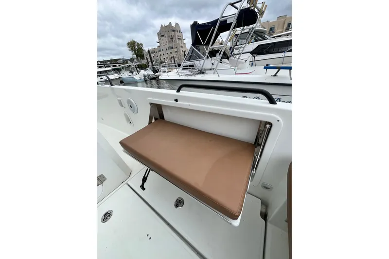 Slide: The Image of Beneteau Flyer 8 SPACEdeck 2020 with foldable seat in marina setting. - 42