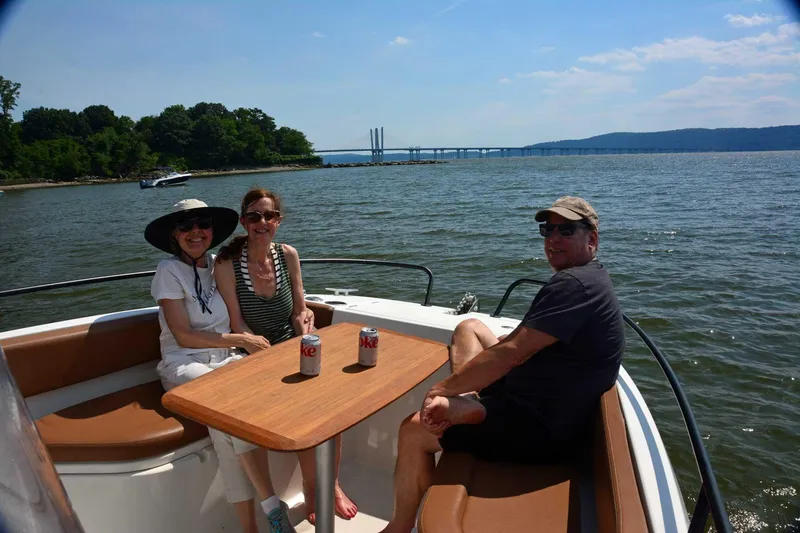 Slide: The Image of Three people relaxing on a 2020 Beneteau Flyer 8 SPACEdeck boat, enjoying a sunny day. - 45