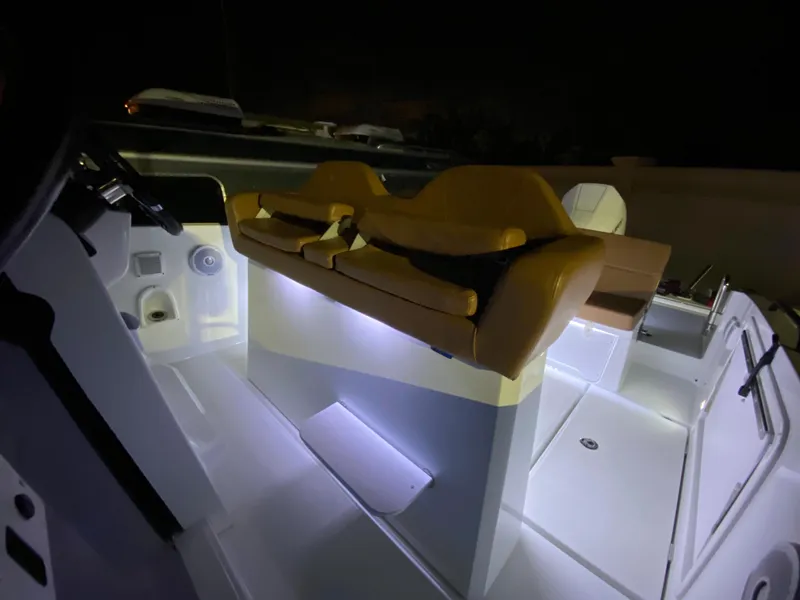 Slide: The Image of 2020 Beneteau Flyer 8 SPACEdeck interior with illuminated seating at night. - 7
