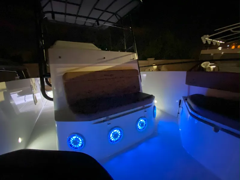 Slide: The Image of Beneteau Flyer 8 SPACEdeck 2020 with illuminated seating area at night. - 8