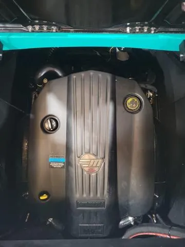 Slide: The Image of 2023 Malibu M220 engine, black cover, detailed view. - 8