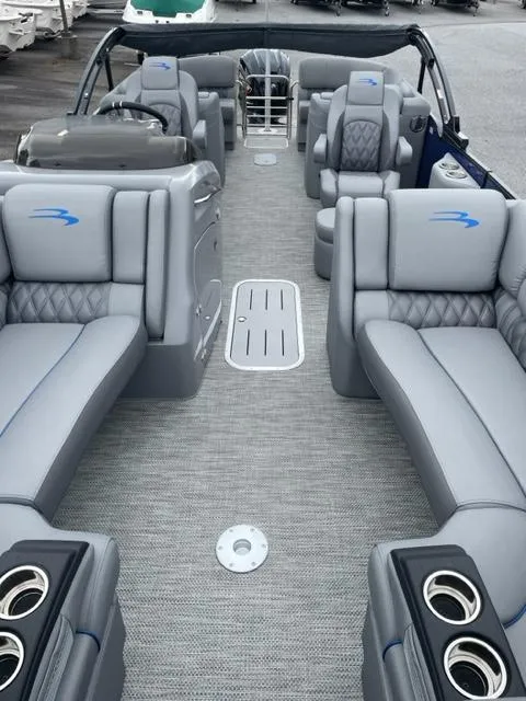 Slide: The Image of 2023 Bennington 23R pontoon boat interior with luxurious gray seating and cup holders. - 5