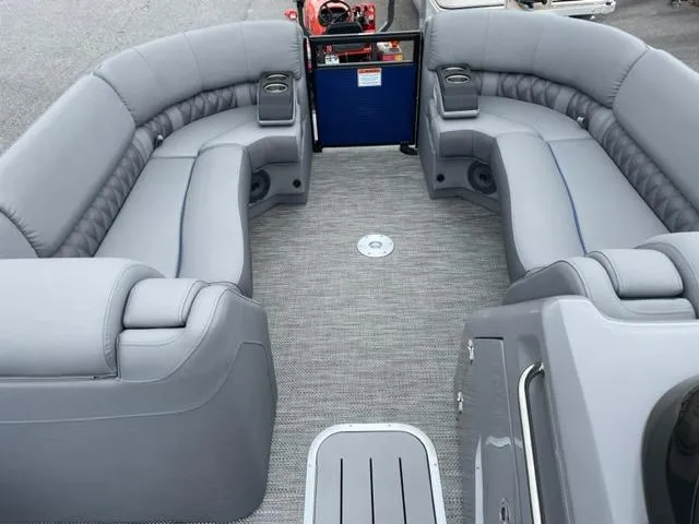 Slide: The Image of 2023 Bennington 23R boat interior with gray seating and cup holders. - 8