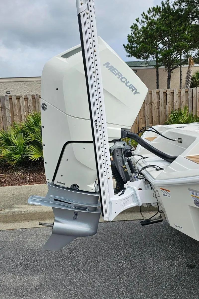 Slide: The Image of 2024 Ranger 2600 Bay boat with Mercury outboard motor. - 13