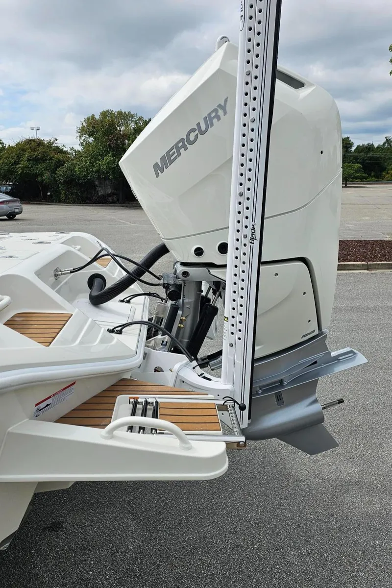 Slide: The Image of 2024 Ranger 2600 Bay boat with Mercury outboard motor. - 14