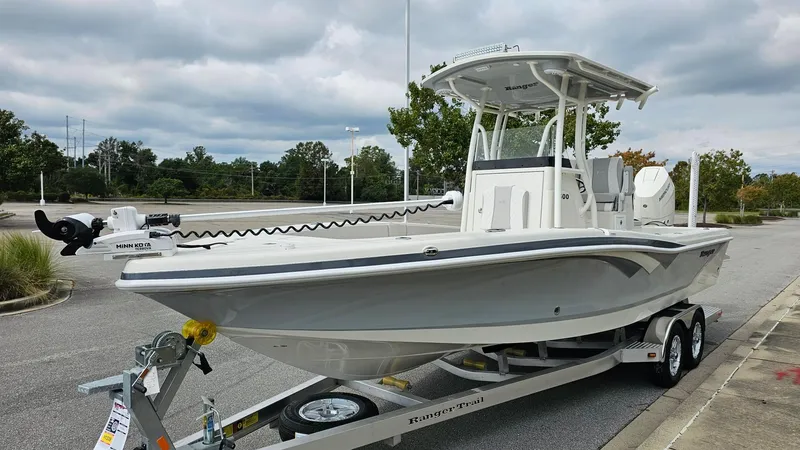 Slide: The Image of 2024 Ranger 2600 Bay boat on trailer in parking lot. - 18