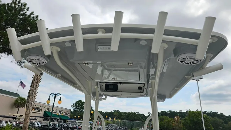 Slide: The Image of 2024 Ranger 2600 Bay boat top view with rod holders and speakers. - 22