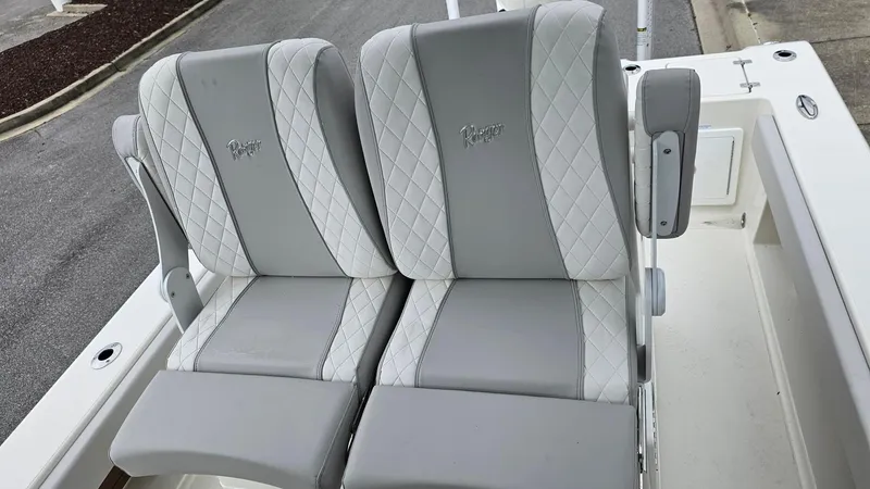 Slide: The Image of 2024 Ranger 2600 Bay boat with dual cushioned seats. - 28