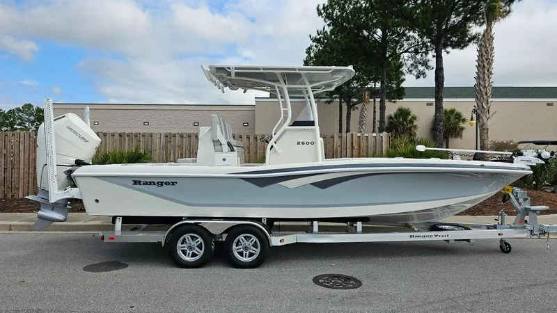 Slide: The Image of 2024 Ranger 2600 Bay boat on trailer, side view. - 30