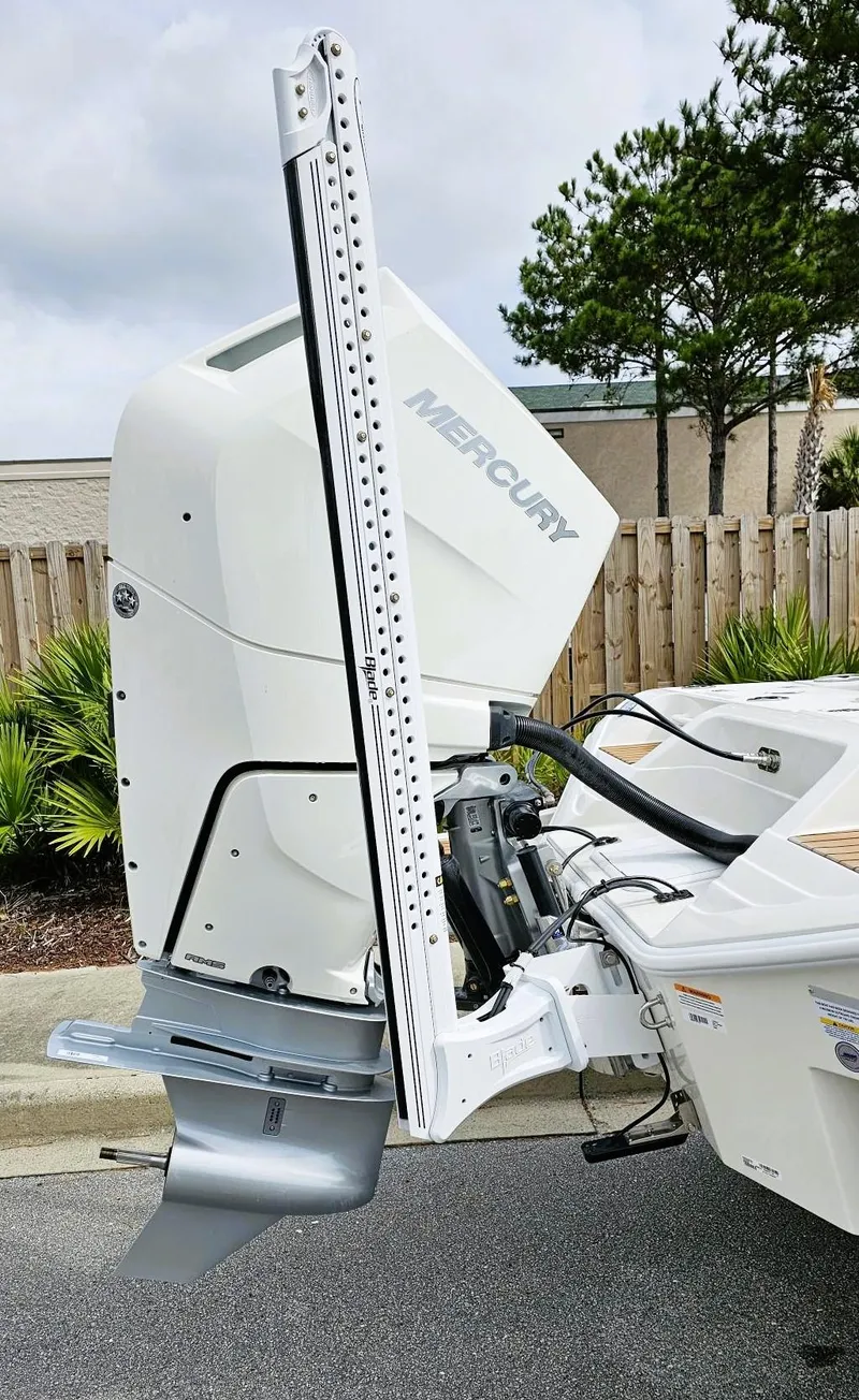 Slide: The Image of 2024 Ranger 2600 Bay boat with Mercury outboard motor. - 4