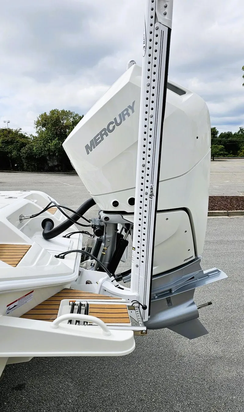 Slide: The Image of 2024 Ranger 2600 Bay boat with Mercury outboard motor. - 6