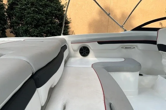 Slide: The Image of Interior view of 2024 Tahoe 185 S boat with cushioned seating and speaker. - 15