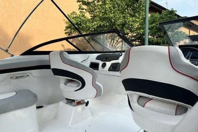Slide: The Image of 2024 Tahoe 185 S boat interior with modern seating and sleek dashboard design. - 8