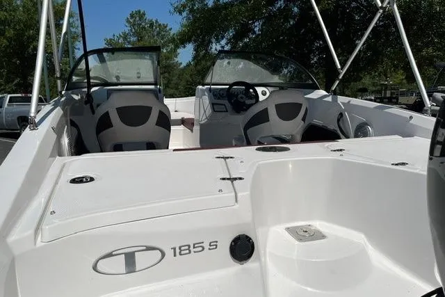 Slide: The Image of 2024 Tahoe 185 S boat interior with dual seating and dashboard view. - 5