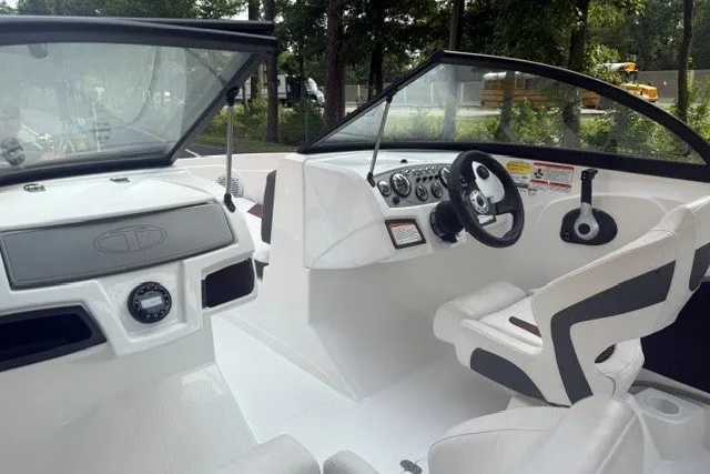 Slide: The Image of 2024 Tahoe 185 S boat interior with sleek dashboard and comfortable seating. - 11
