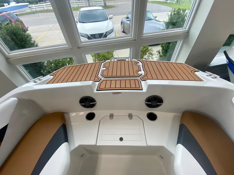 Slide: The Image of 2026 Starcraft SVX 171 boat interior with teak deck and seating, viewed from above. - 19