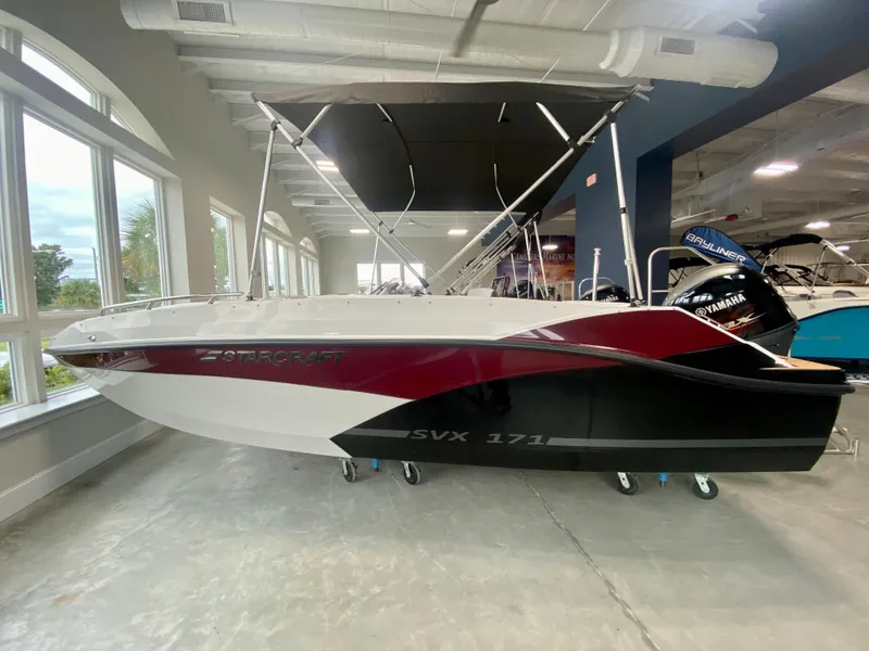 The Image of 2026 Starcraft SVX 171 boat displayed indoors with sleek design and modern features. - 0