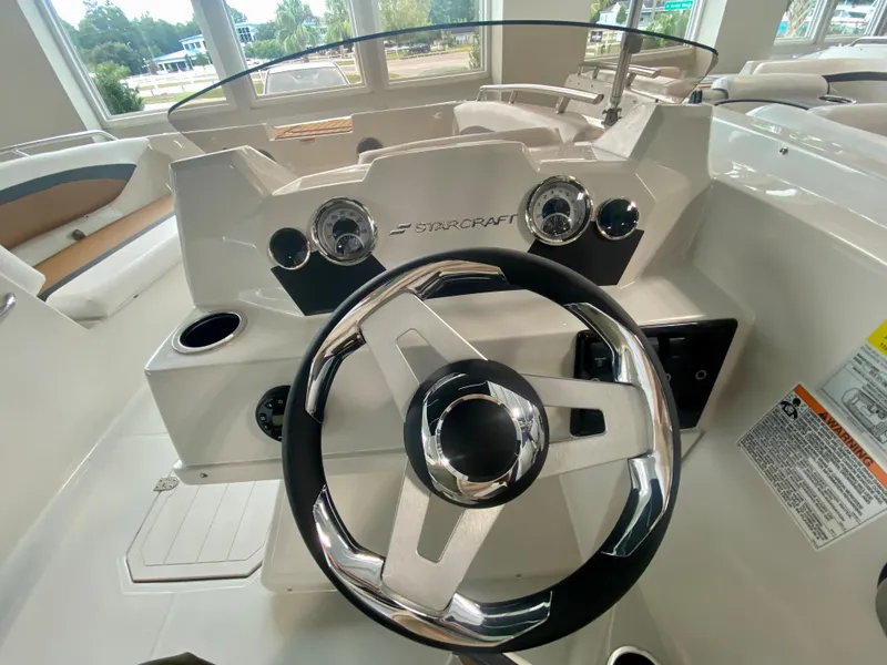 Slide: The Image of 2026 Starcraft SVX 171 boat dashboard with steering wheel and gauges. - 10