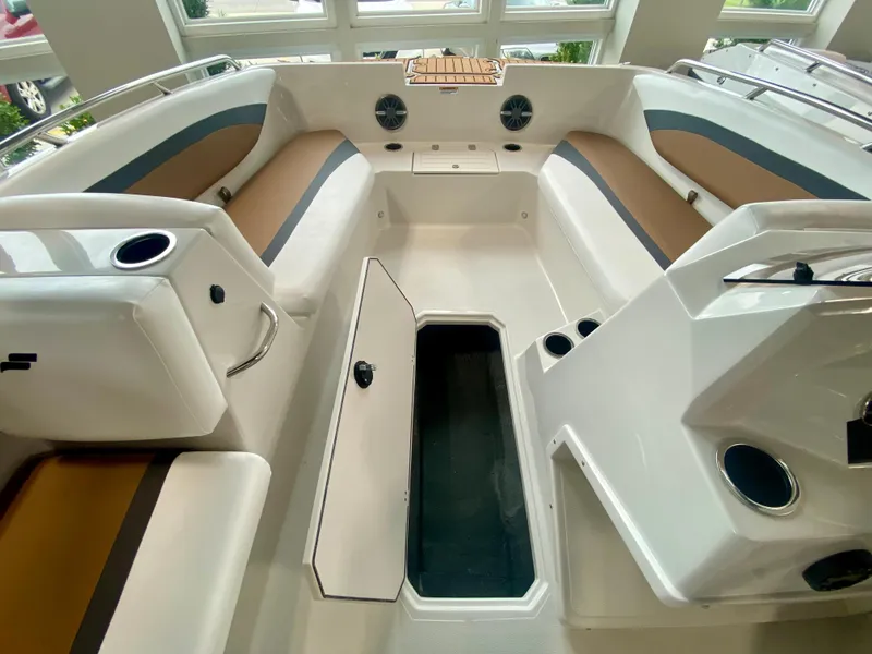 Slide: The Image of 2026 Starcraft SVX 171 boat interior with seating, storage, and cup holders. - 13