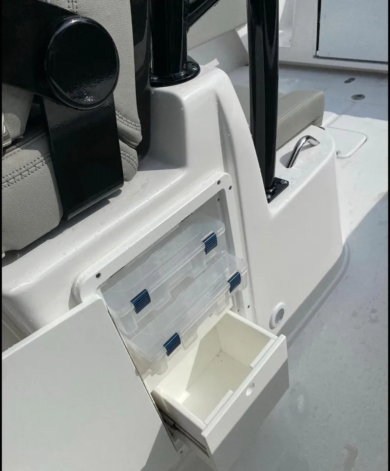 Slide: The Image of 2025 Cape Horn Yachts 32 XS storage compartment with tackle boxes. - 14