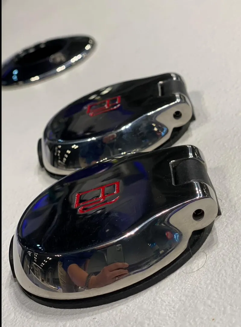 Slide: The Image of Close-up of 2025 Cape Horn Yachts 32 XS chrome fittings on a white surface. - 18