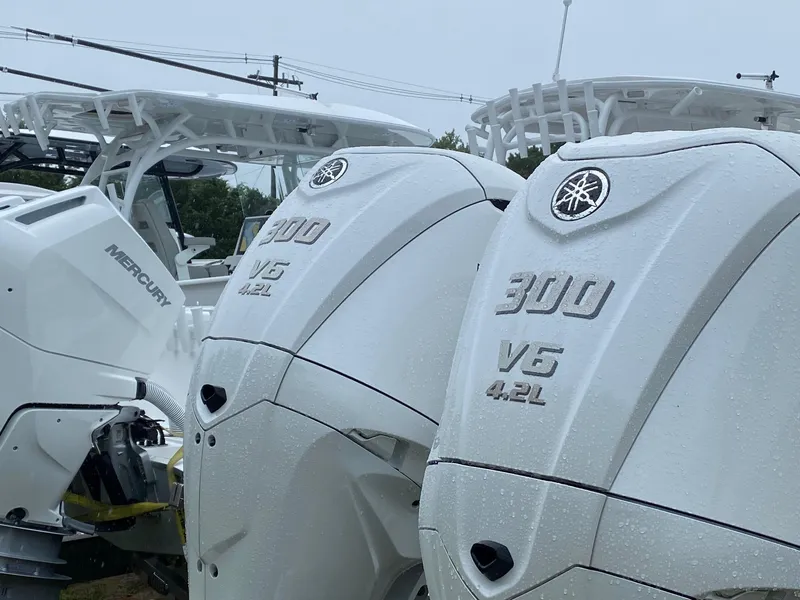 Slide: The Image of 2025 Cape Horn Yachts 32 XS with Yamaha 300 V6 engines, wet with rain. - 7